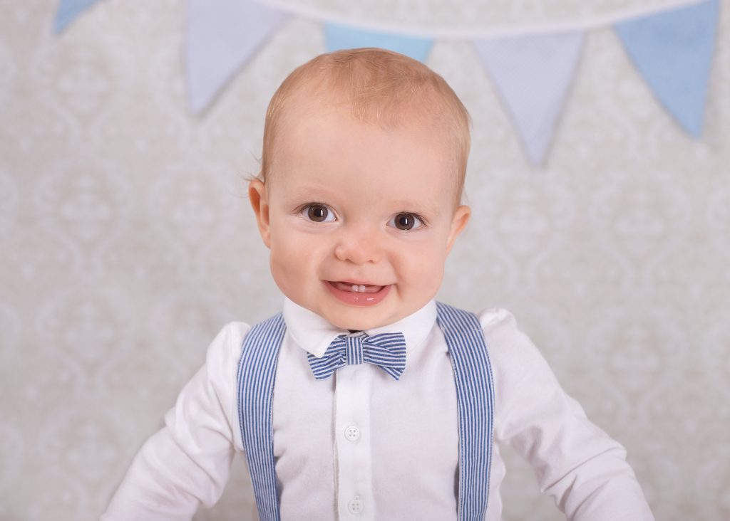 boy celebrating his first birthday with a photoshoot with kent newborn photographer