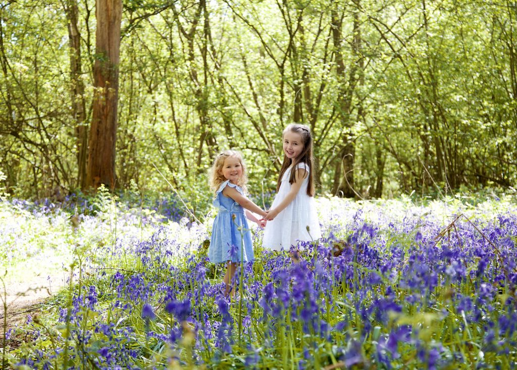 sisters in a bluebell wood