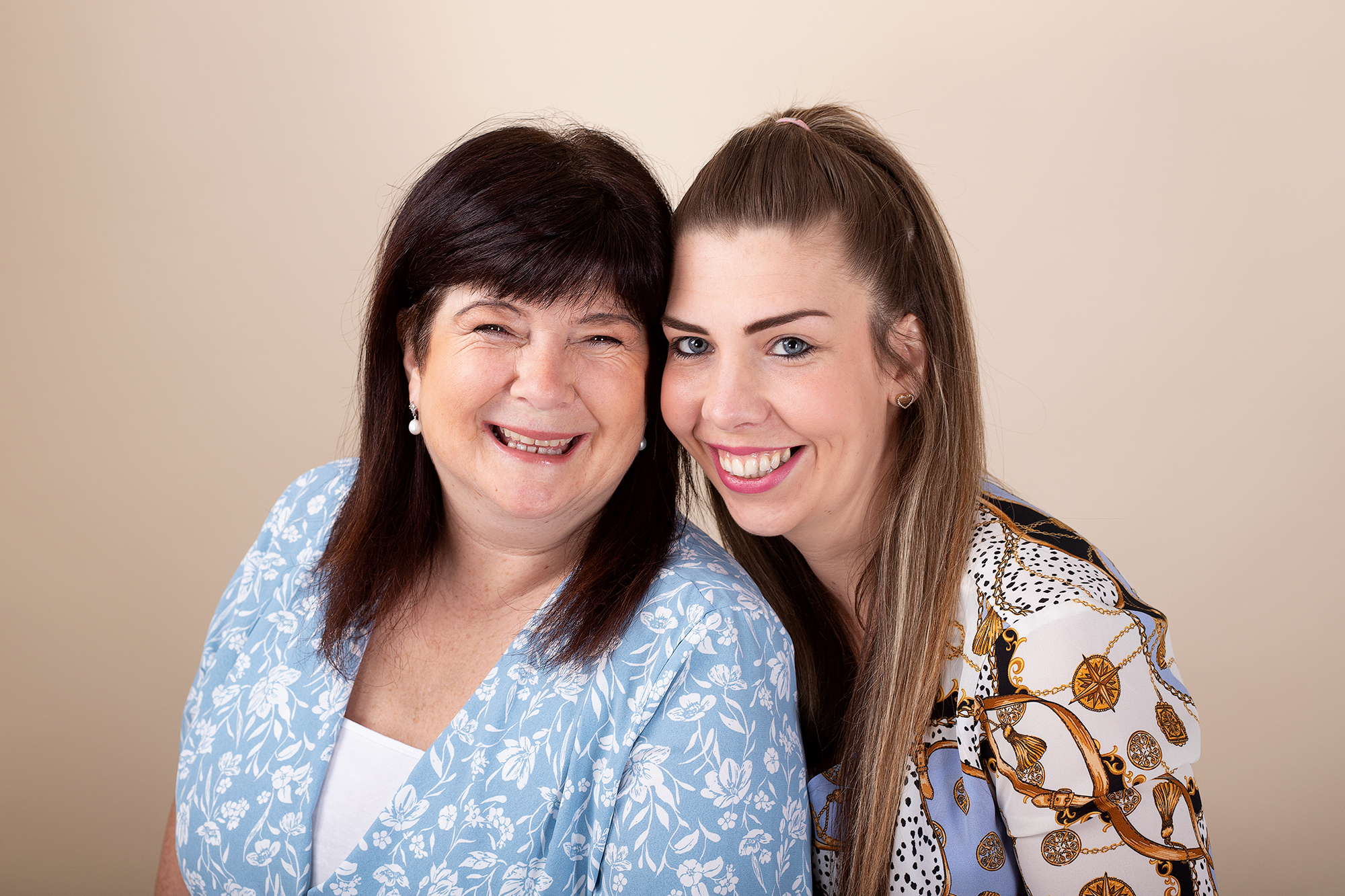 mum and daughter smiling during a mothers day photoshoot in Kent