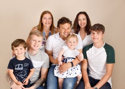 family smiling during a photoshoot in Kent