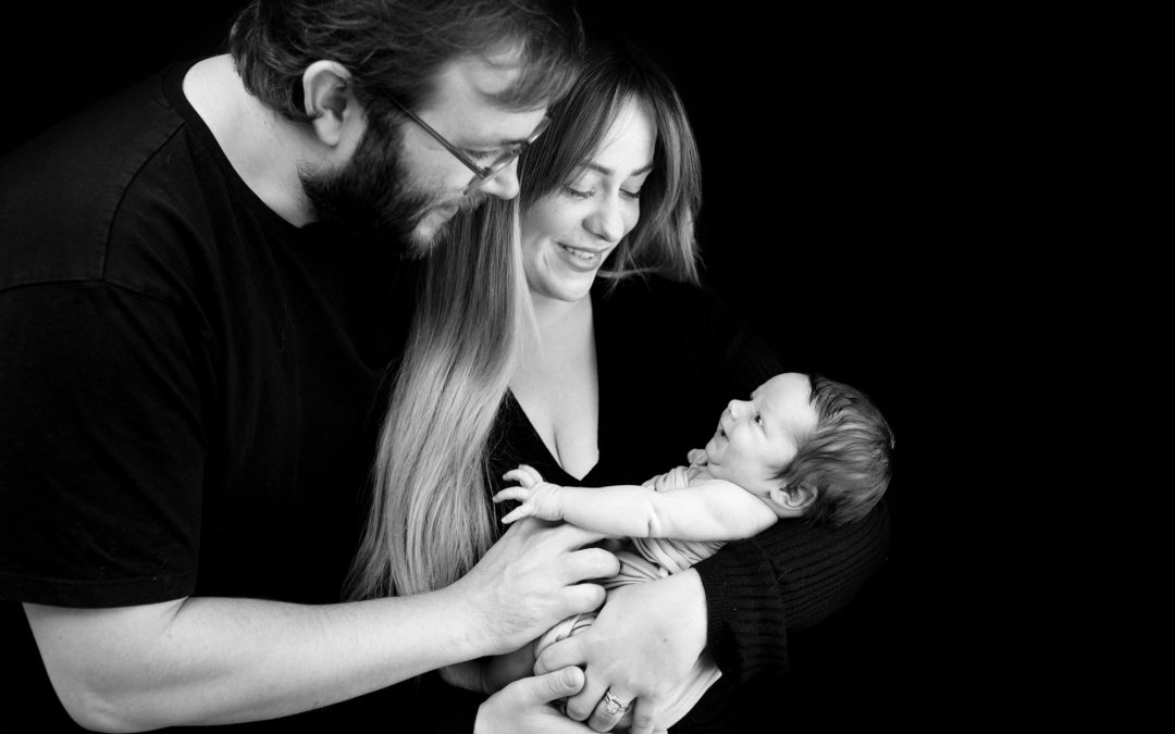 baby smiling and mum and dad photographed in Chatham